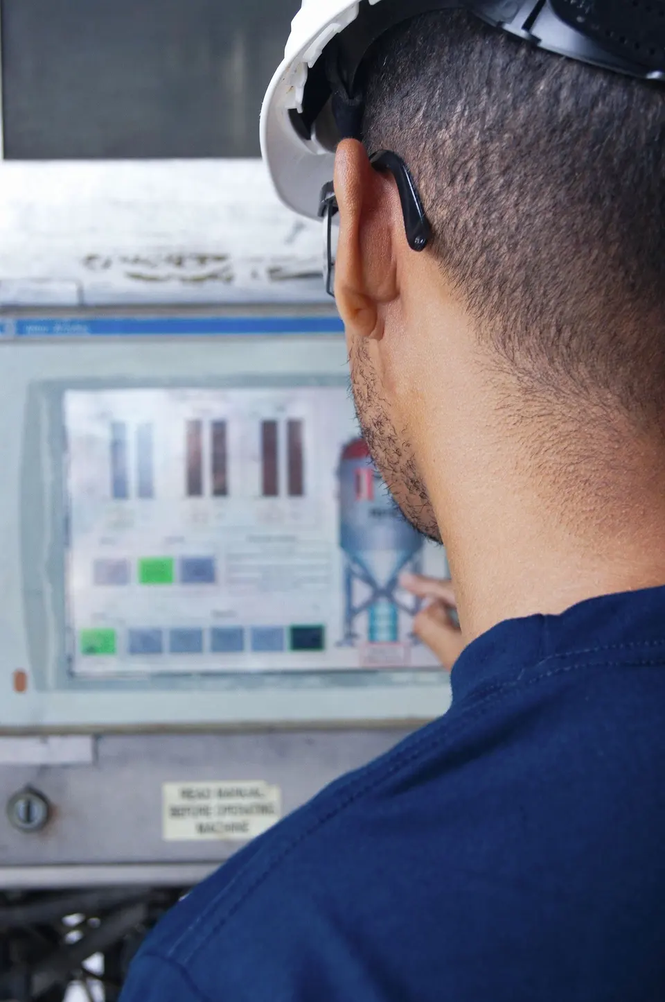 Engineer Operating Industrial Control Panel